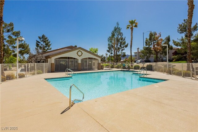 1617 Cave Spring Dr, Henderson, NV 89014 - community pool featuring a patio and fence