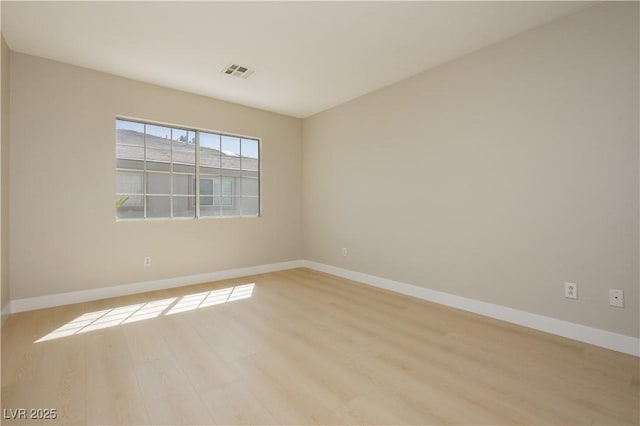 1617 Cave Spring Dr, Henderson, NV 89014 - spare room featuring baseboards, light wood finished floors, and visible vents