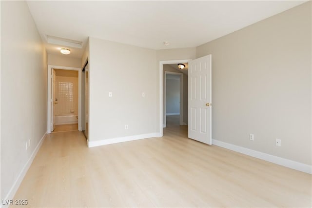 1617 Cave Spring Dr, Henderson, NV 89014 - empty room featuring baseboards, attic access, and light wood-style flooring