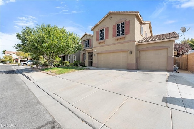248 Hyssop Ct, Henderson, NV 89015 - mediterranean / spanish home featuring fence, an attached garage, stucco siding, concrete driveway, and a tiled roof