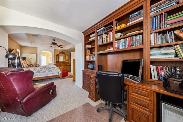 248 Hyssop Ct, Henderson, NV 89015 - home office with ceiling fan, carpet floors, arched walkways, a tray ceiling, and visible vents
