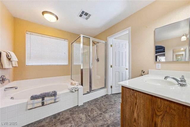 248 Hyssop Ct, Henderson, NV 89015 - full bathroom with visible vents, a shower stall, a garden tub, and vanity