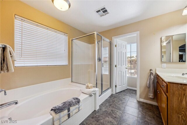 248 Hyssop Ct, Henderson, NV 89015 - full bathroom with vanity, tile patterned floors, visible vents, a garden tub, and a stall shower