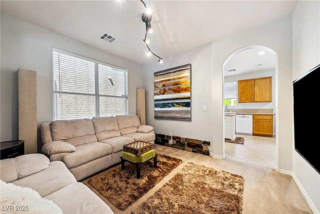 248 Hyssop Ct, Henderson, NV 89015 - living room with visible vents, arched walkways, and baseboards