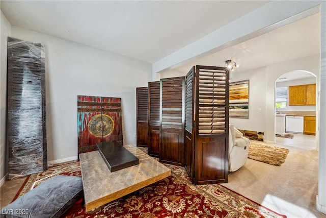 248 Hyssop Ct, Henderson, NV 89015 - living room with carpet floors, arched walkways, and baseboards