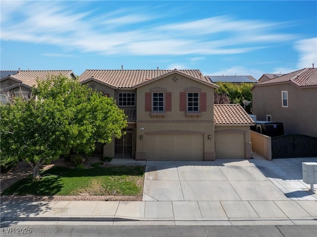 248 Hyssop Ct, Henderson, NV 89015 - mediterranean / spanish house with a tiled roof, a garage, driveway, and stucco siding