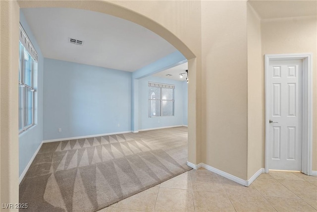248 Hyssop Ct, Henderson, NV 89015 - corridor featuring visible vents, arched walkways, tile patterned flooring, baseboards, and carpet flooring