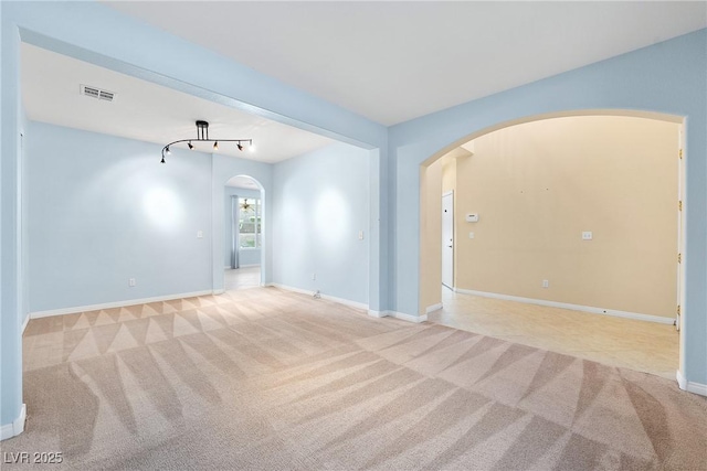 248 Hyssop Ct, Henderson, NV 89015 - carpeted spare room featuring arched walkways, baseboards, and visible vents