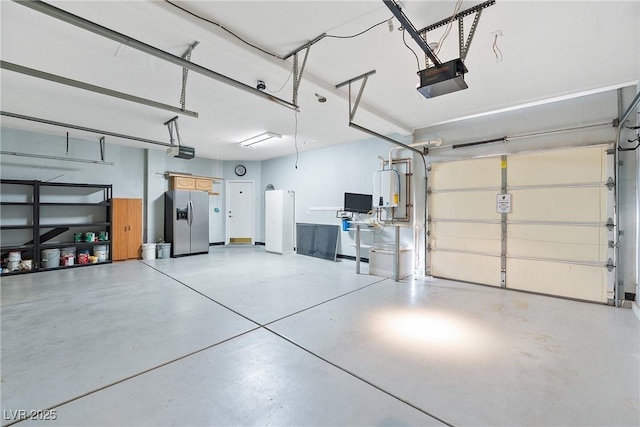 248 Hyssop Ct, Henderson, NV 89015 - garage with stainless steel fridge, a garage door opener, and water heater