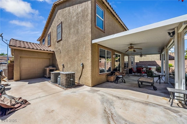 248 Hyssop Ct, Henderson, NV 89015 - exterior space featuring a garage, stucco siding, ceiling fan, a tiled roof, and driveway