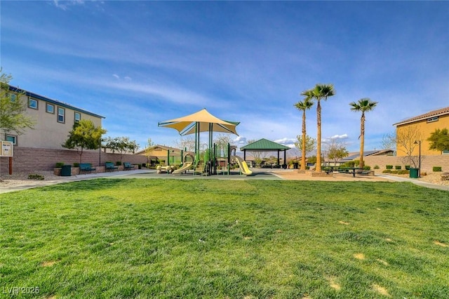 view of community featuring a yard and playground community