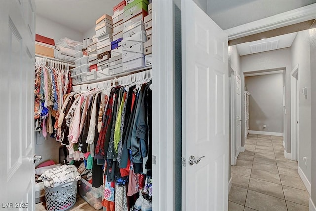 walk in closet with visible vents and tile patterned floors