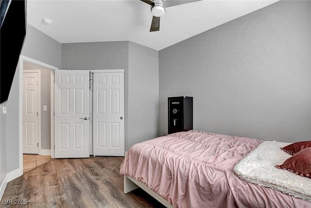 bedroom featuring a ceiling fan and wood finished floors