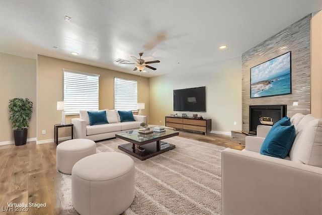 living area with recessed lighting, baseboards, a ceiling fan, and light wood finished floors
