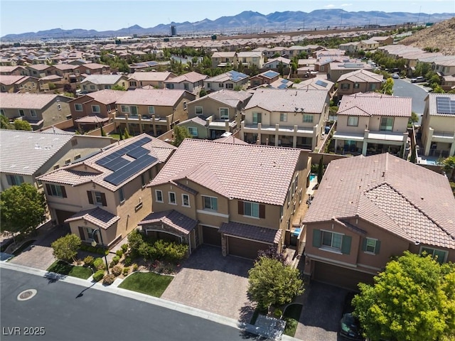 birds eye view of property featuring a mountain view and a residential view