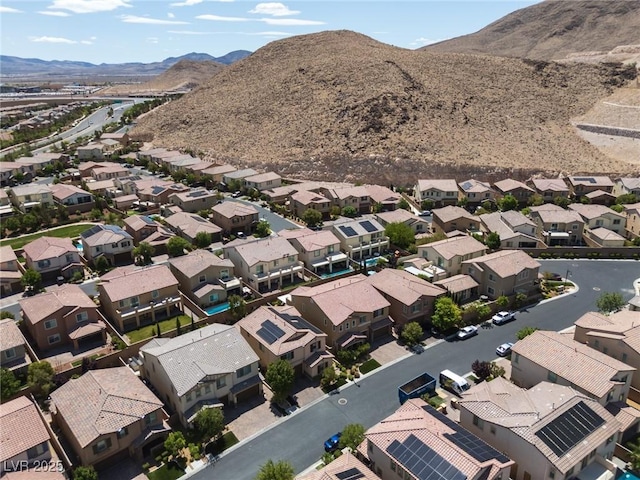 aerial view featuring a mountain view and a residential view
