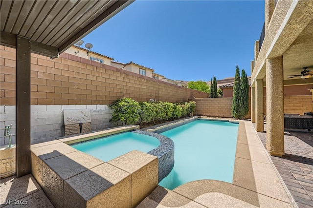 view of pool with a fenced backyard, ceiling fan, a patio, and a pool with connected hot tub