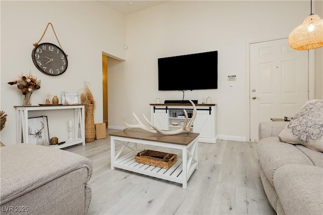 504 Painted Cloud Pl, Las Vegas, NV 89144 - living room featuring light wood-style flooring and baseboards