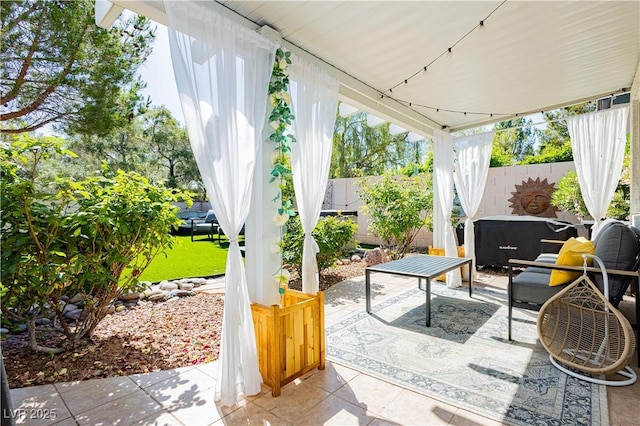 504 Painted Cloud Pl, Las Vegas, NV 89144 - view of patio with a fenced backyard and a hot tub