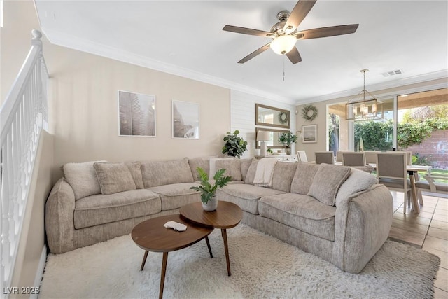 living area featuring visible vents, crown molding, and ceiling fan with notable chandelier