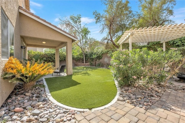view of yard with a pergola, a fenced backyard, and a patio area