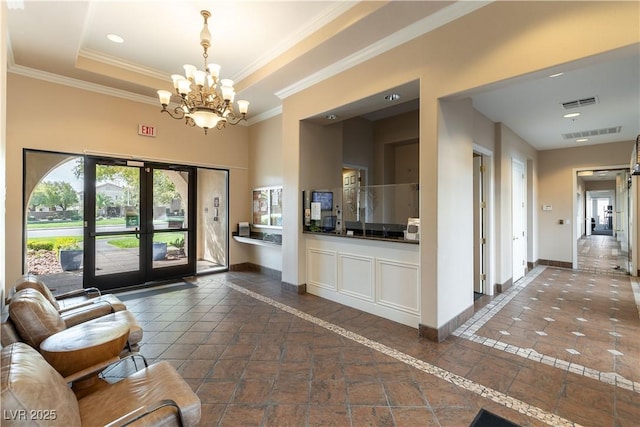 welcome area with french doors, a chandelier, and visible vents
