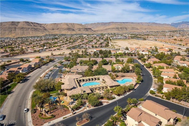birds eye view of property with a mountain view and a residential view