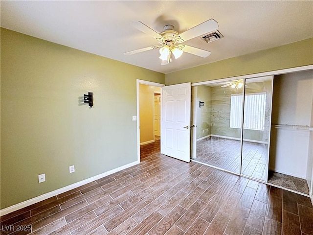 5704 Burdel St, Las Vegas, NV 89149 - unfurnished bedroom with baseboards, wood finished floors, visible vents, and a closet