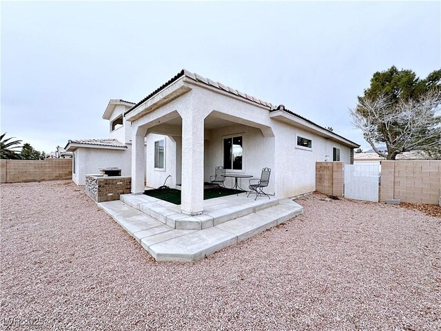 5704 Burdel St, Las Vegas, NV 89149 - back of property with a patio, a tile roof, a fenced backyard, and stucco siding