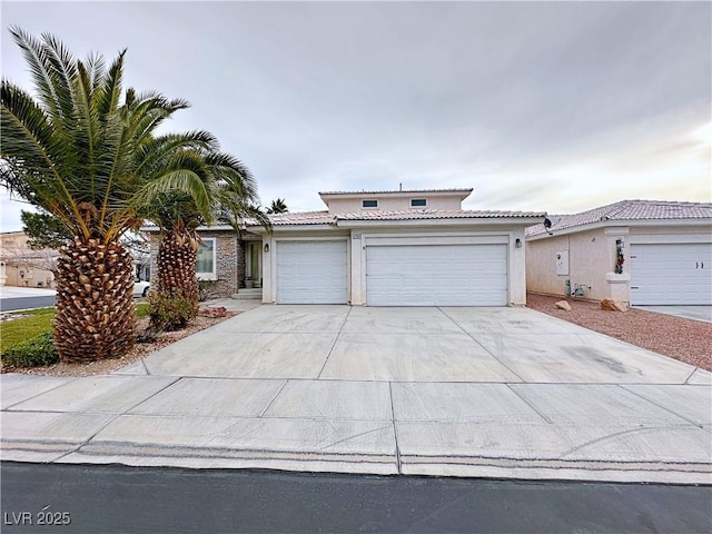 5704 Burdel St, Las Vegas, NV 89149 - traditional home with concrete driveway, stucco siding, a tile roof, and a garage
