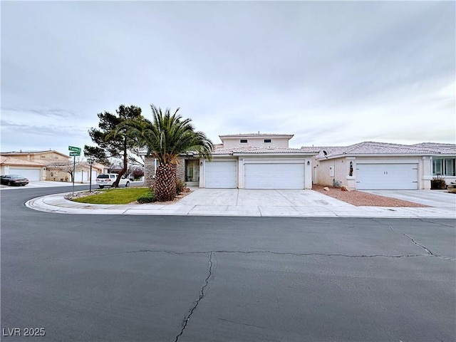 5704 Burdel St, Las Vegas, NV 89149 - traditional-style home featuring concrete driveway, an attached garage, a tile roof, and stucco siding