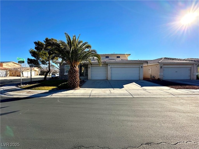 5704 Burdel St, Las Vegas, NV 89149 - traditional-style house featuring an attached garage, stucco siding, a tile roof, and concrete driveway