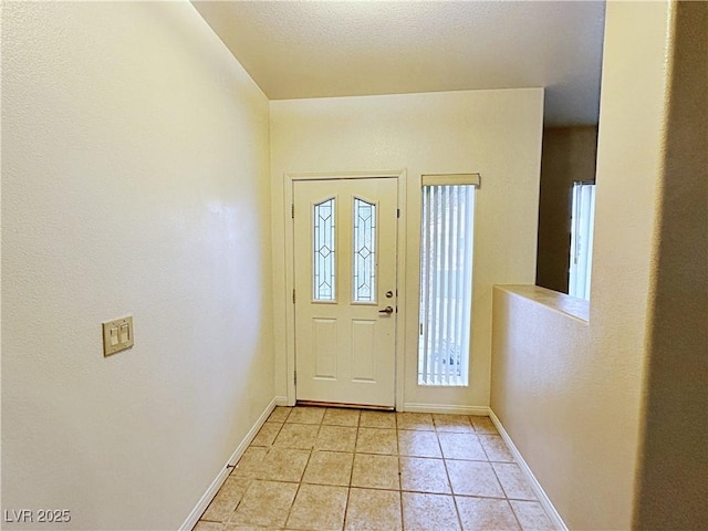 5704 Burdel St, Las Vegas, NV 89149 - foyer with light tile patterned flooring and baseboards