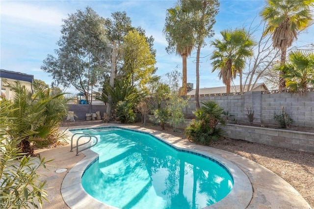 view of swimming pool featuring a fenced in pool and a fenced backyard