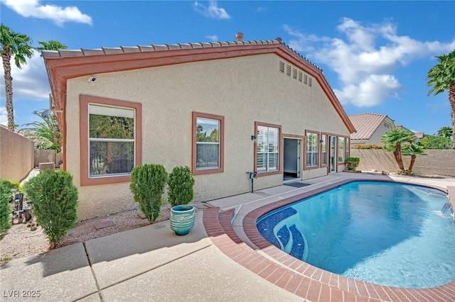 view of swimming pool with a patio, a fenced backyard, and a fenced in pool