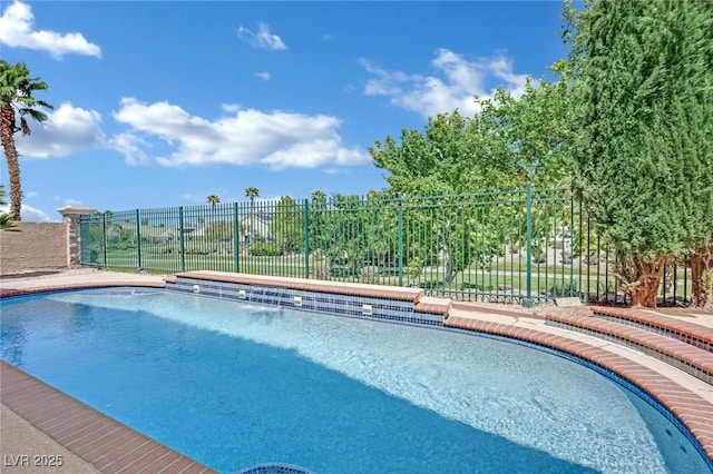 view of swimming pool featuring fence and a fenced in pool