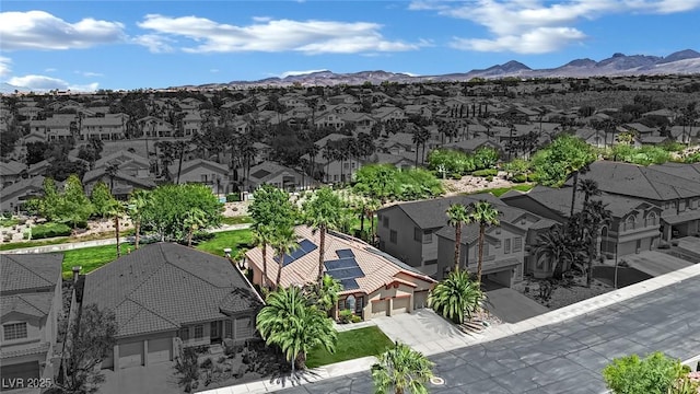 drone / aerial view featuring a residential view and a mountain view