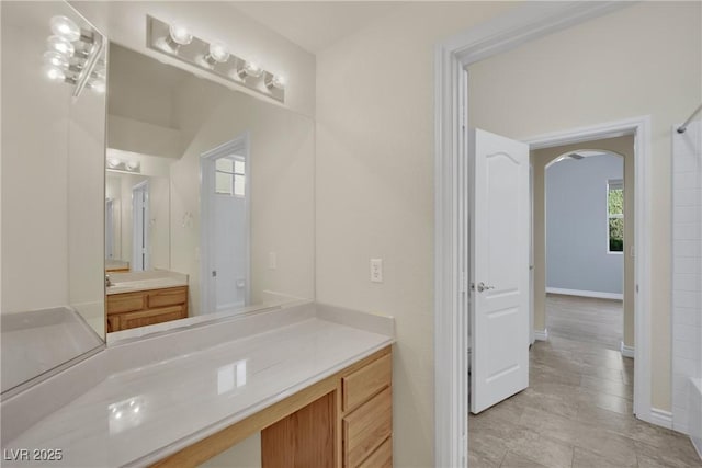 bathroom featuring vanity and baseboards