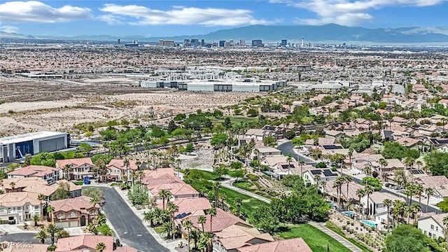 birds eye view of property with a mountain view