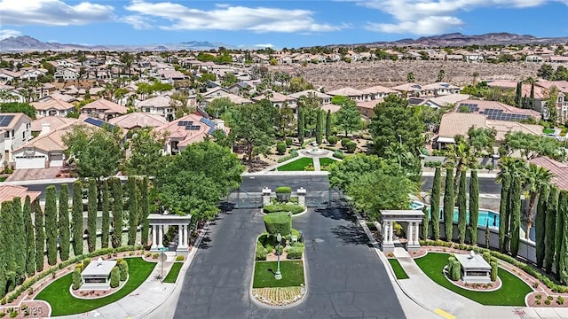 birds eye view of property featuring a mountain view and a residential view