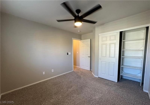 unfurnished bedroom featuring carpet flooring, baseboards, a closet, and ceiling fan