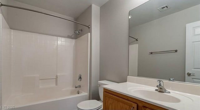bathroom featuring toilet, tub / shower combination, and vanity