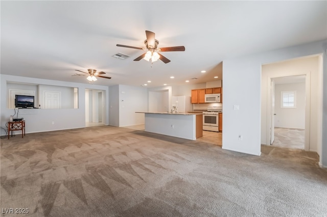 4436 Hatch Bend Ave, North Las Vegas, NV 89031 - unfurnished living room featuring visible vents, recessed lighting, ceiling fan, and light colored carpet
