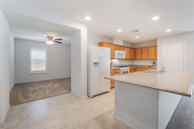 4436 Hatch Bend Ave, North Las Vegas, NV 89031 - kitchen with light carpet, a sink, white appliances, recessed lighting, and visible vents