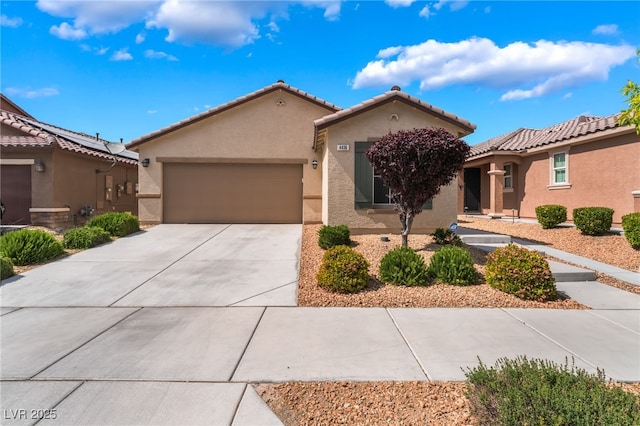 4436 Hatch Bend Ave, North Las Vegas, NV 89031 - view of front of property with a tiled roof, an attached garage, driveway, and stucco siding