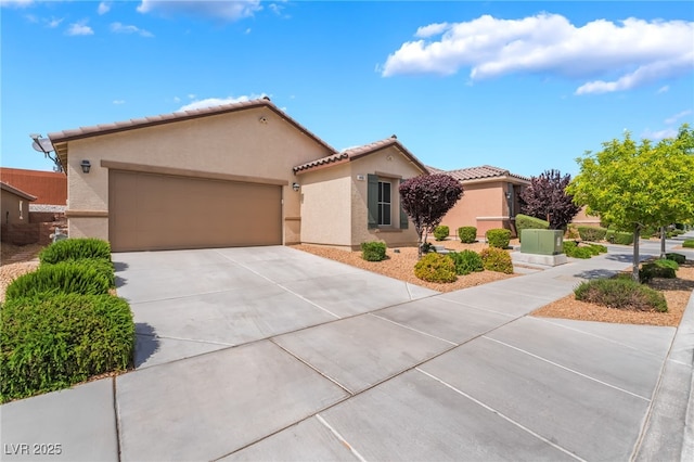 4436 Hatch Bend Ave, North Las Vegas, NV 89031 - ranch-style home with a garage, stucco siding, concrete driveway, and a tile roof