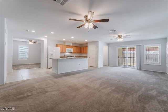 4436 Hatch Bend Ave, North Las Vegas, NV 89031 - unfurnished living room with visible vents, a ceiling fan, recessed lighting, and light colored carpet
