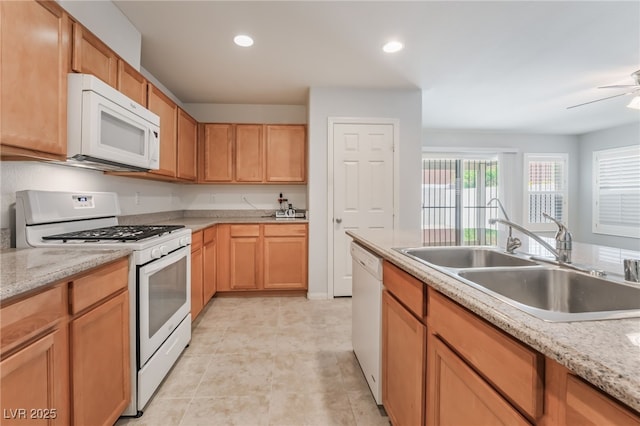 4436 Hatch Bend Ave, North Las Vegas, NV 89031 - kitchen with recessed lighting, a sink, ceiling fan, and white appliances