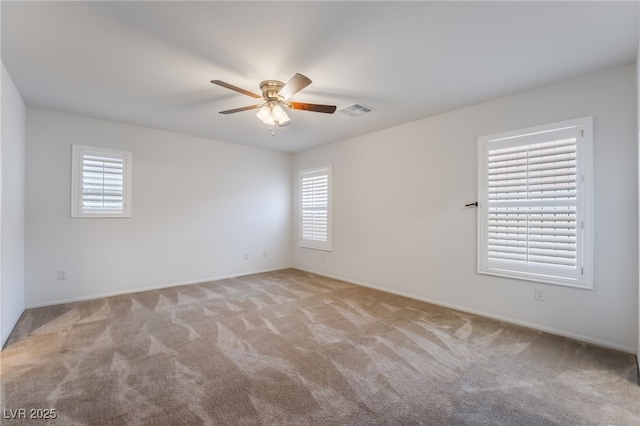 4436 Hatch Bend Ave, North Las Vegas, NV 89031 - spare room featuring a ceiling fan, visible vents, a wealth of natural light, and carpet