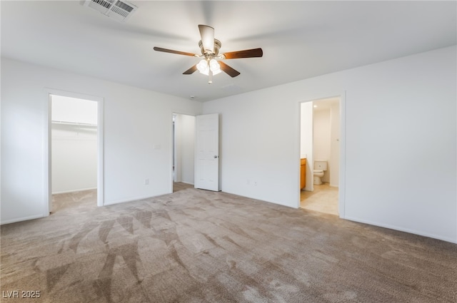 4436 Hatch Bend Ave, North Las Vegas, NV 89031 - unfurnished bedroom with visible vents, carpet floors, a walk in closet, and ensuite bathroom
